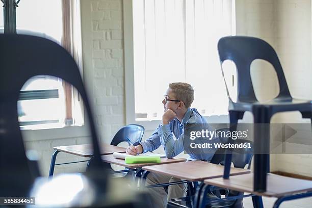 Window Alone Student 164 Young Student Looking Out Windows Of Classroom Stock Photos, High ...
