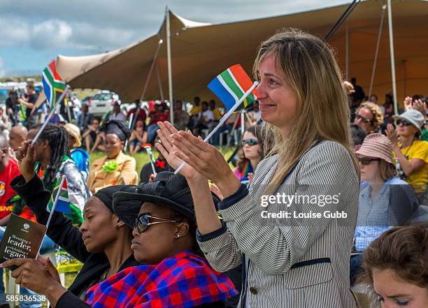 Tears at the funeral of former South African President Nelson Mandela at his rural home in Qunu village. People gathered at sites where large TV...