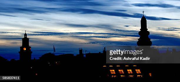 urban skyline in silhouette during dusk - stockholm skyline stock pictures, royalty-free photos & images