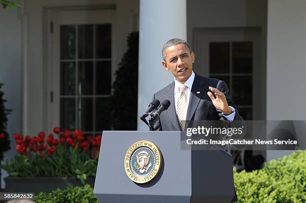 Standing just outside the Oval Office in the Rose Garden, President Barack Obama makes a statement in the Rose Garden speaking to representatives...