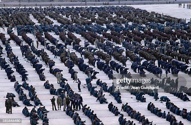 Iraqi prisoners are put on show before the media and Iranian General, Zahir Nehzad, by members of the Iranian army. Also present at the gathering are...