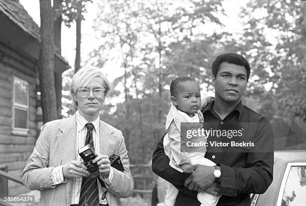 Muhammad Ali, Hana Ali and Andy Warhol in Deer Lake, Pennsylvania, where Ali set up his training camp.