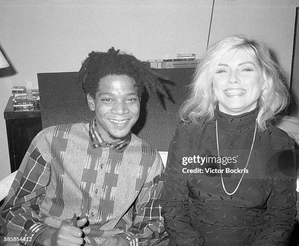 Jean Michel Basquait and Debbie Harry in New York City around Christmas of 1986.