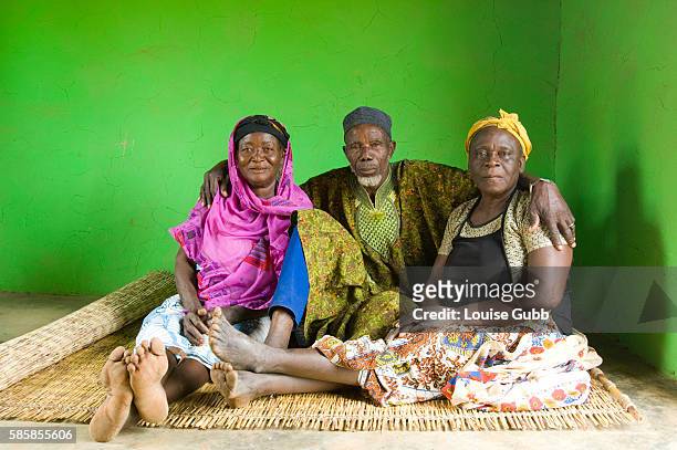 Awabu Alidu with her husband Alidu Mumumi and his other wife Afishetu Alidu. Awabu is free of guinea worm this year, for the first time since she can...