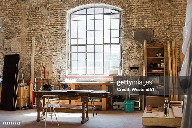 interior of a carpenter's workshop - workbench stock-fotos und bilder