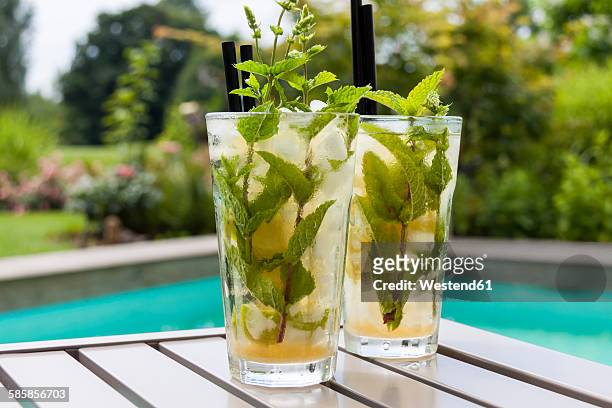two glasses of mojito - pool table stock-fotos und bilder