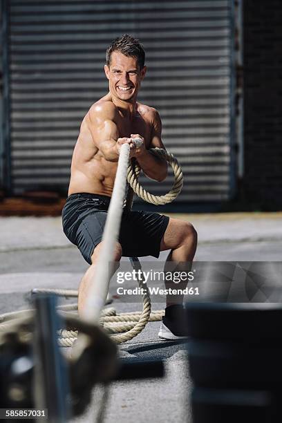 661 Man Pulling Rope Gym Stock Photos, High-Res Pictures, and