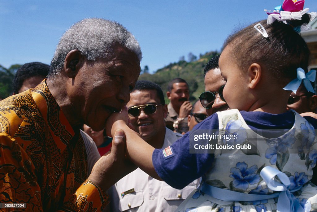 Nelson Mandela Kissing Prison Worker's Daughter