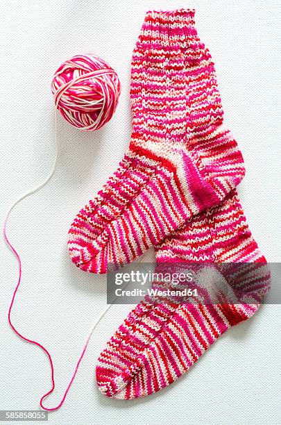 hand-knitted pair of woolen socks - knitted stock-fotos und bilder