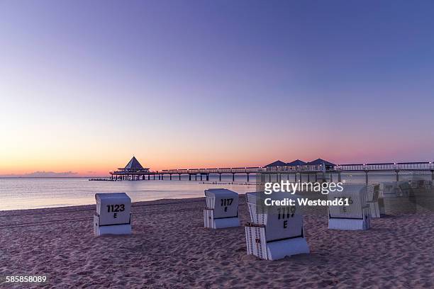 germany, usedom, heringsdorf, sunrise at pier - usedom photos et images de collection