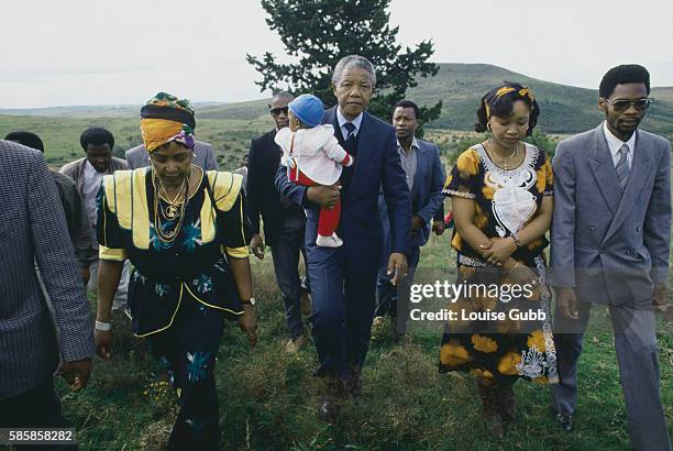 Winnie and Nelson Mandela with their grandson Bambatha, daughter Zenzekile "Zinzi" Mandela, and son-in-law Zweli Hlongwane, during their visit to...