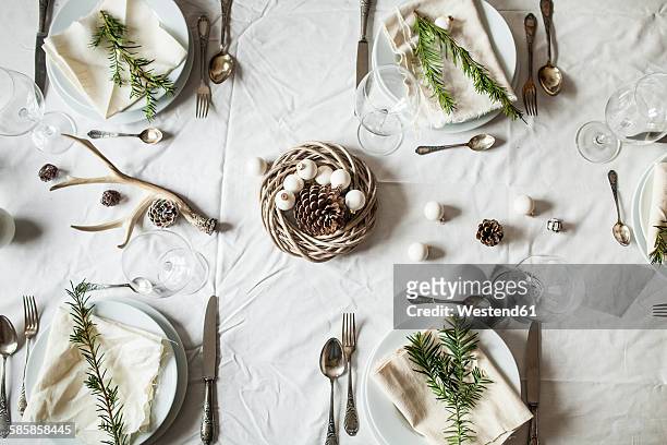 festive laid table at christmas time - christmas still life stock-fotos und bilder