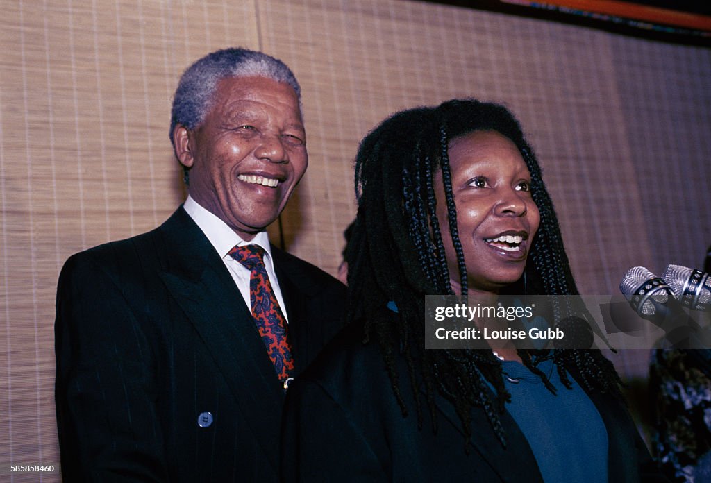 Nelson Mandela with Actress Whoopi Goldberg at Microphone