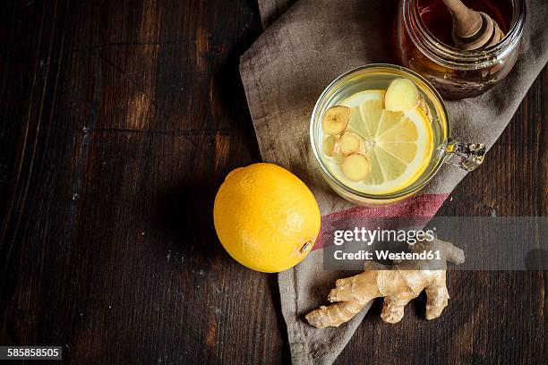 hot lemon-ginger infusion with honey - ginger glasses stock-fotos und bilder
