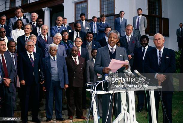 Nelson Mandela and President F.W. De Klerk make opening press statements during the first talks between the South African government and the ANC....