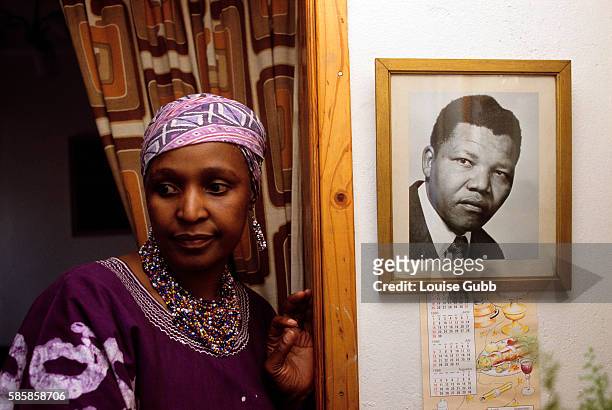 Winnie Mandela defies her ban orders not to return to her home and the picture of her husband Nelson Mandela, a former President of South Africa and...