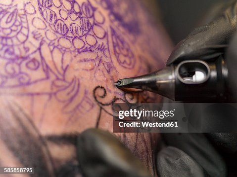 Tattoo artist at work Tattoo artist at work