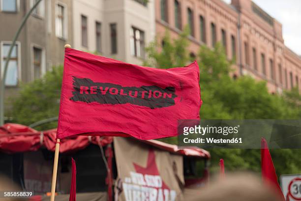 germany, berlin, kreuzberg, red flag on demonstation on 1st of may - may day international workers day stockfoto's en -beelden