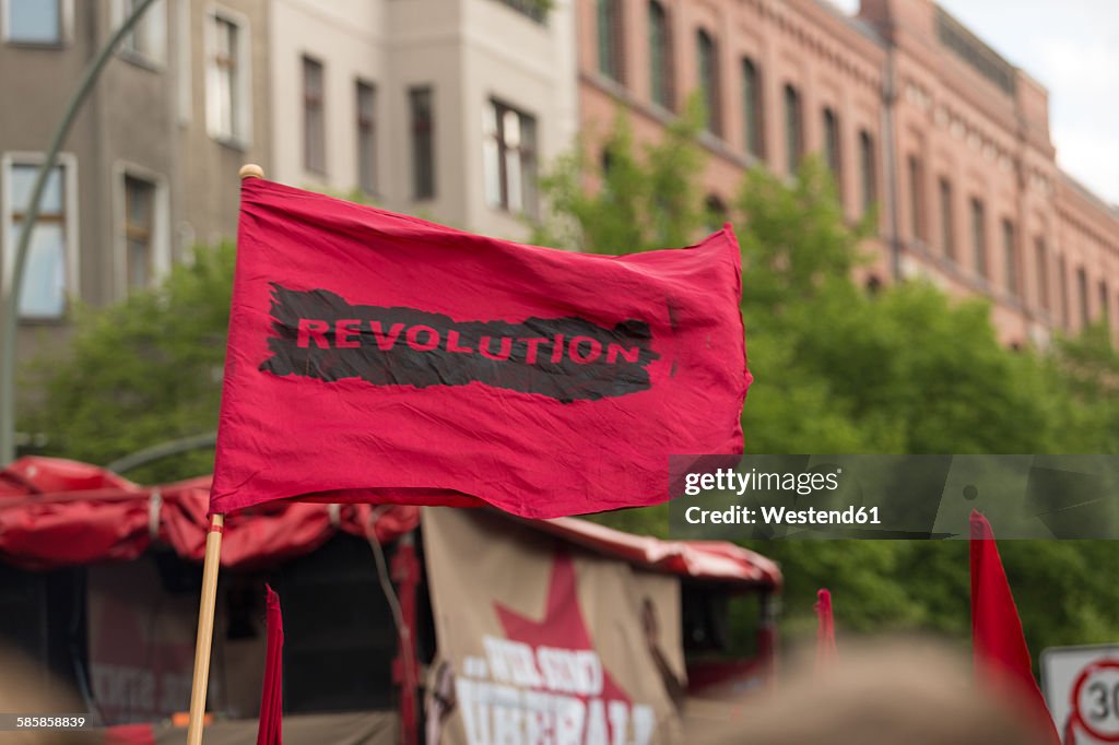 Germany, Berlin, Kreuzberg, red flag on demonstation on 1st of May