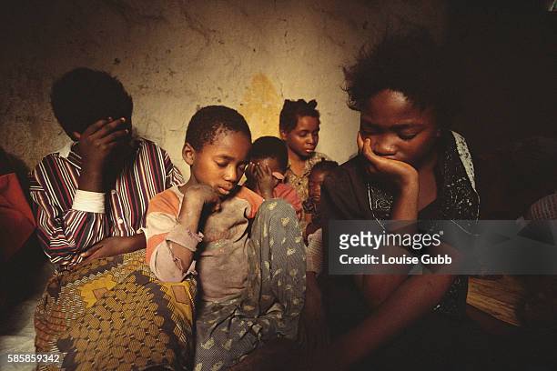 Group of siblings, with ages ranging from 5 to 15, mourn for their mother who has just died of AIDS. Seventy percent of the world's HIV/AIDS victims...