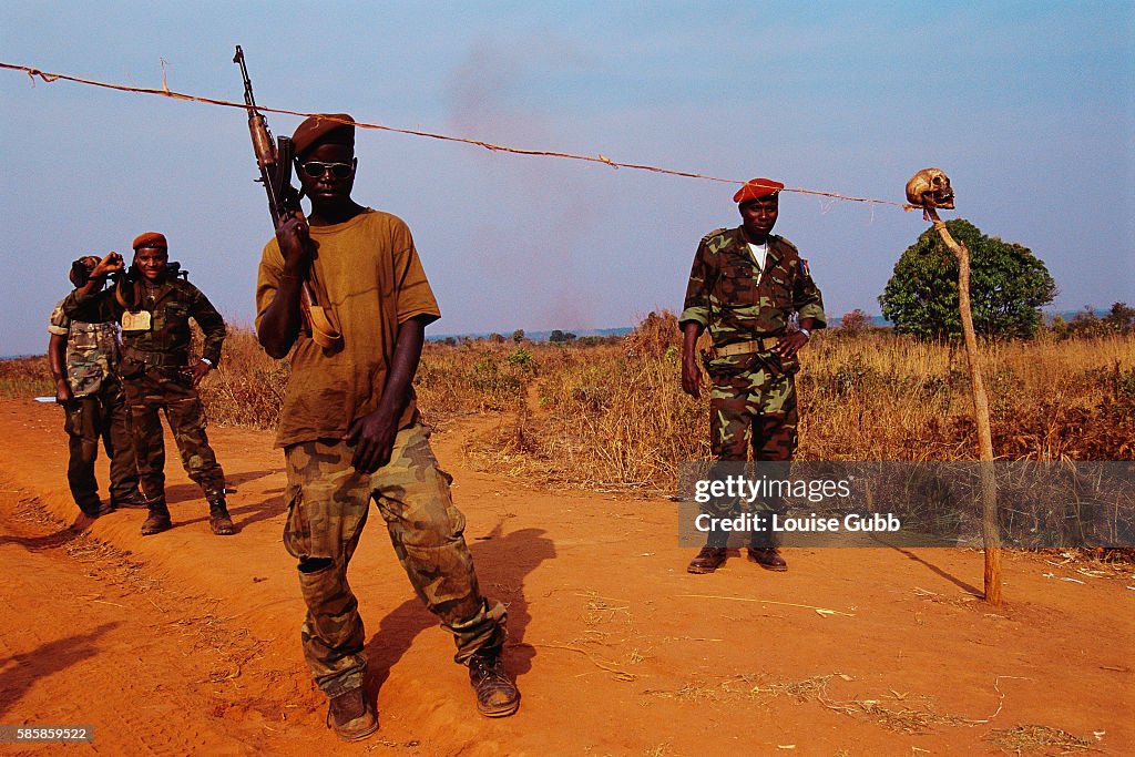 Soldiers at Roadblock Marked with Skull