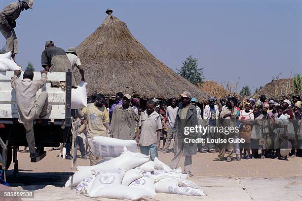 Food from the World Food Program arrives in a refugee camp in Kuito, Angola. After Angola gained independence from Portugal in 1975, civil war...