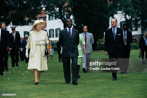 South African Deputy President Thabo Mbeki escorts Queen Elizabeth II and Prince Philip during their visit to Pretoria, South Africa.