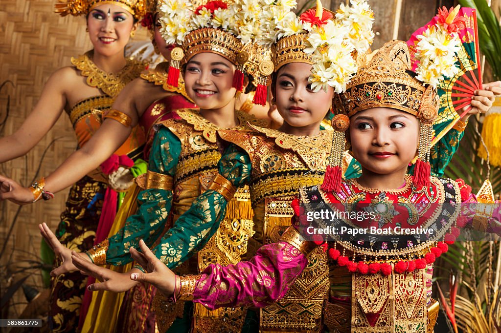 Row of traditional Balinese dancers in costume