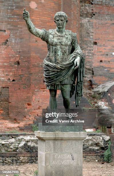 statue of emperor augustus at porta palatina - porta palatina stock pictures, royalty-free photos & images