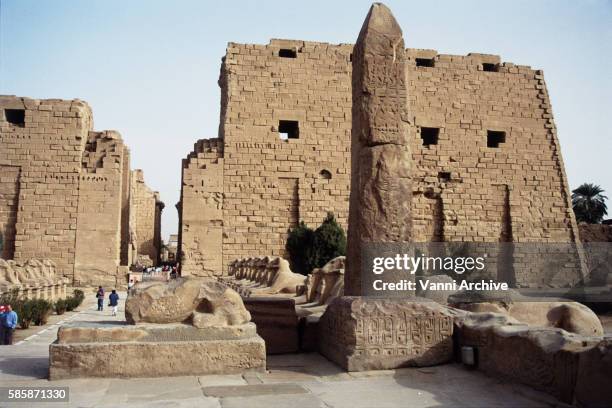 temple of amun in karnak: avenue of criosphinxes and obelisk of seti ii against the first pylon - cartouche of ramses stock pictures, royalty-free photos & images