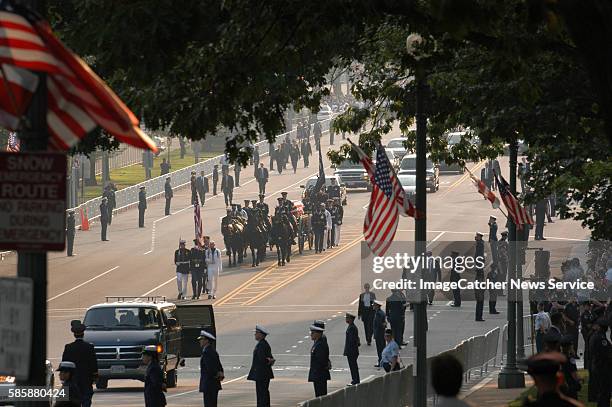 The casket of former President Ronald Wilson Reagan en route to the Capitol Rotunda, where his body will lie in state, ahead of Friday's official...