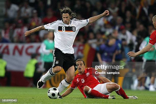 Torsten Frings and Dariusz Dudka during the EURO 2008 preliminary round group B soccer match between Germany and Poland at the Woerthersee stadium in...