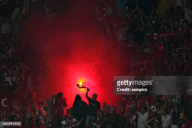 Fans lighting flares during the UEFA EURO 2008 quarter final match between Croatia and Turkey at the Ernst Happel stadium in Vienna, Austria. Turkey...