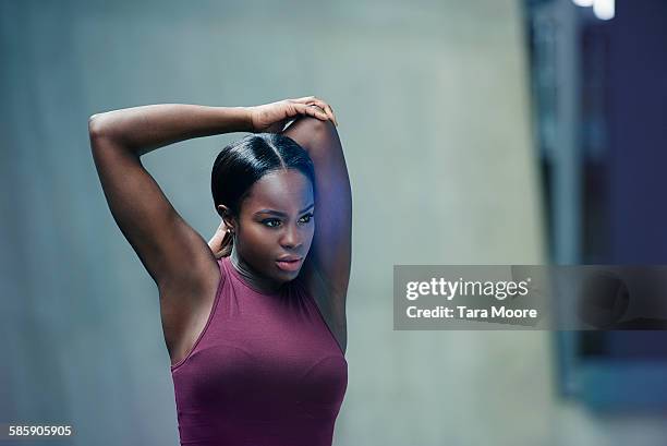 sports woman stretching - woman fitness focus stock pictures, royalty-free photos & images