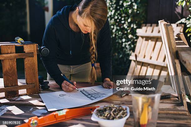 woman drawing a design sketch - garden drawing stockfoto's en -beelden