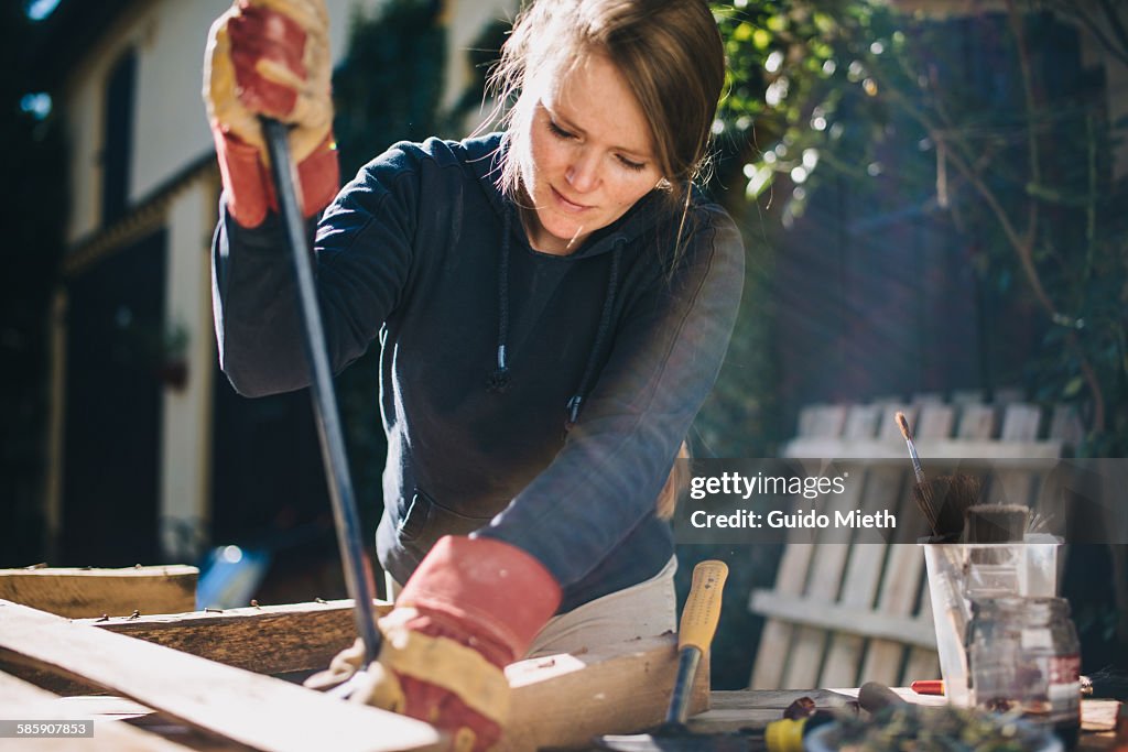 Woman treating a europallet