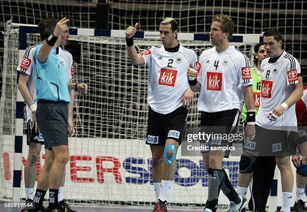 Pascal Hens , Oliver Roggisch , Sebastian Preiss of Germany arguing with the referee during the IHF World Championships match Norway vs. Germany, in...