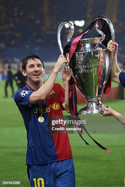 Lionel Messi of Barcelona with the trophy after winning the UEFA Champions League final