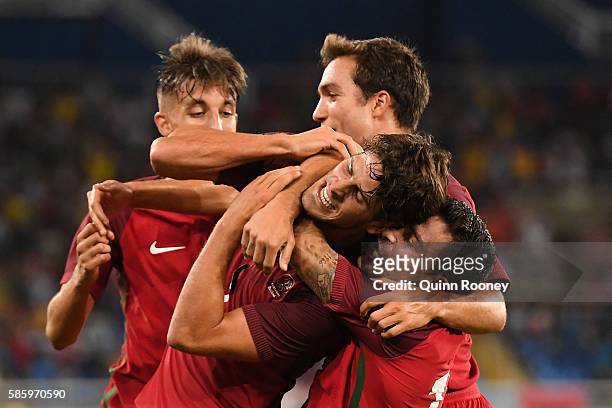 Paciencia Goncalo of Portugal celebrates his goal with his teammates during the Men's Group D first round match between Portugal and Argentina during...