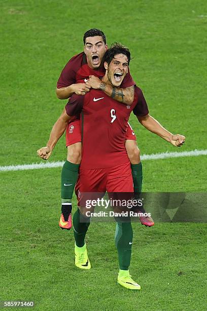 Paciencia Goncalo of Portugal celebrates with his team after scoring during the Men's Group D first round match between Portugal and Argentina during...