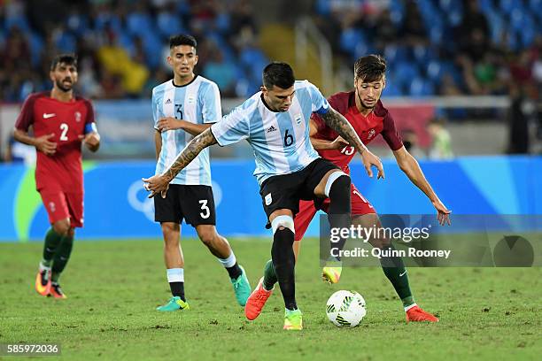 Victor Cuesta of Argentina controls the ball during the Men's Group D first round match between Portugal and Argentina during the Rio 2016 Olympic...
