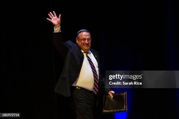 Maine Governor Paul LePage, , greets the crowd before Republican Presidential candidate Donald Trump speaks at the Merrill Auditorium on August 4,...