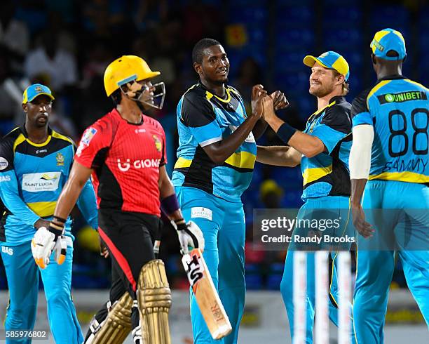 Basseterre , Saint Kitts and Nevis - 4 August 2016; Delorn Johnson and Shane Watson of St. Lucia Zouks celebrate the dismissal of Umar Akmal of...