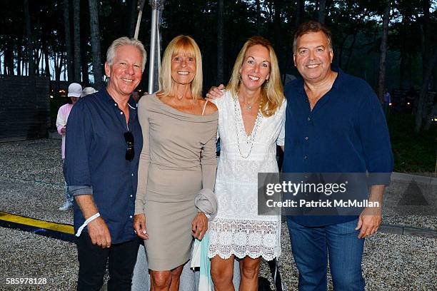 John B, Pat B, Maud Cabet and Rosario Cornilio attend The 23rd Annual Watermill Center Summer Benefit & Auction at The Watermill Center on July 30,...