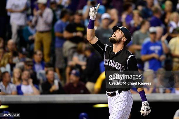 Colorado Rockies outfielder David Dahl celebrates after hitting a two-run home run in the fourth inning during the game at Coors Field against the...