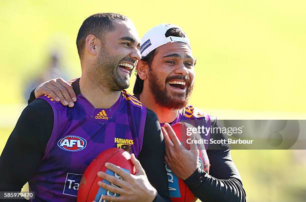 Shaun Burgoyne and Cyril Rioli of the Hawks laugh during a Hawthorn Hawks AFL training session at Waverley Park on August 5, 2016 in Melbourne,...