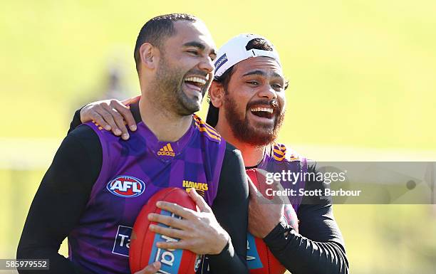 Shaun Burgoyne and Cyril Rioli of the Hawks laugh during a Hawthorn Hawks AFL training session at Waverley Park on August 5, 2016 in Melbourne,...