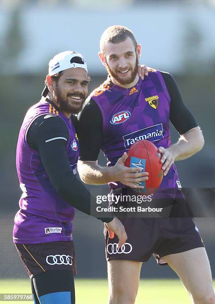 Cyril Rioli and Kurt Heatherley of the Hawks laugh during a Hawthorn Hawks AFL training session at Waverley Park on August 5, 2016 in Melbourne,...
