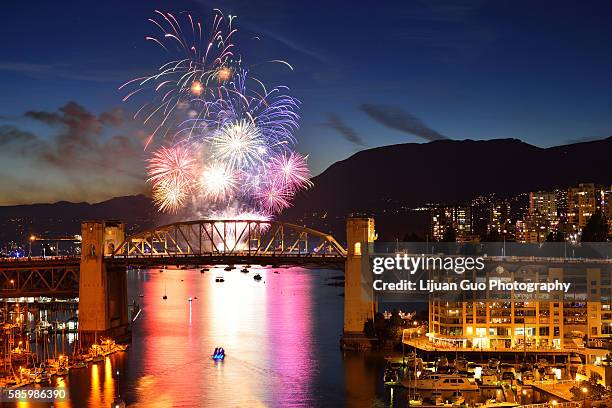 celebration of lights, fireworks display at english bay, vancouver, bc - english bay stock-fotos und bilder