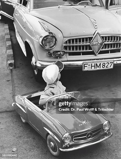 Boy in Pedal Car in Front of Borgward Car